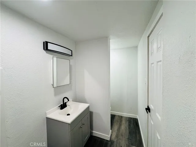 a bathroom with a sink toilet and vanity