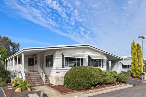 a view of house with a yard