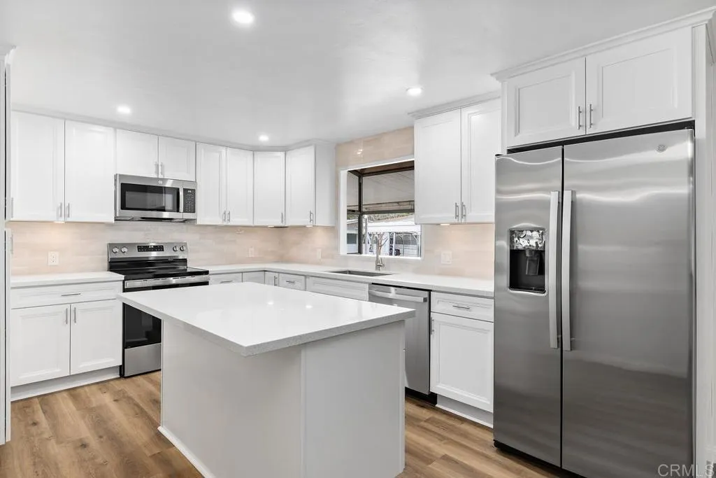 7467 Mission Gorge Road, Unit SPC 10 Santee, CA 92071 - Photo 14 of 44 a kitchen with a refrigerator sink and microwave