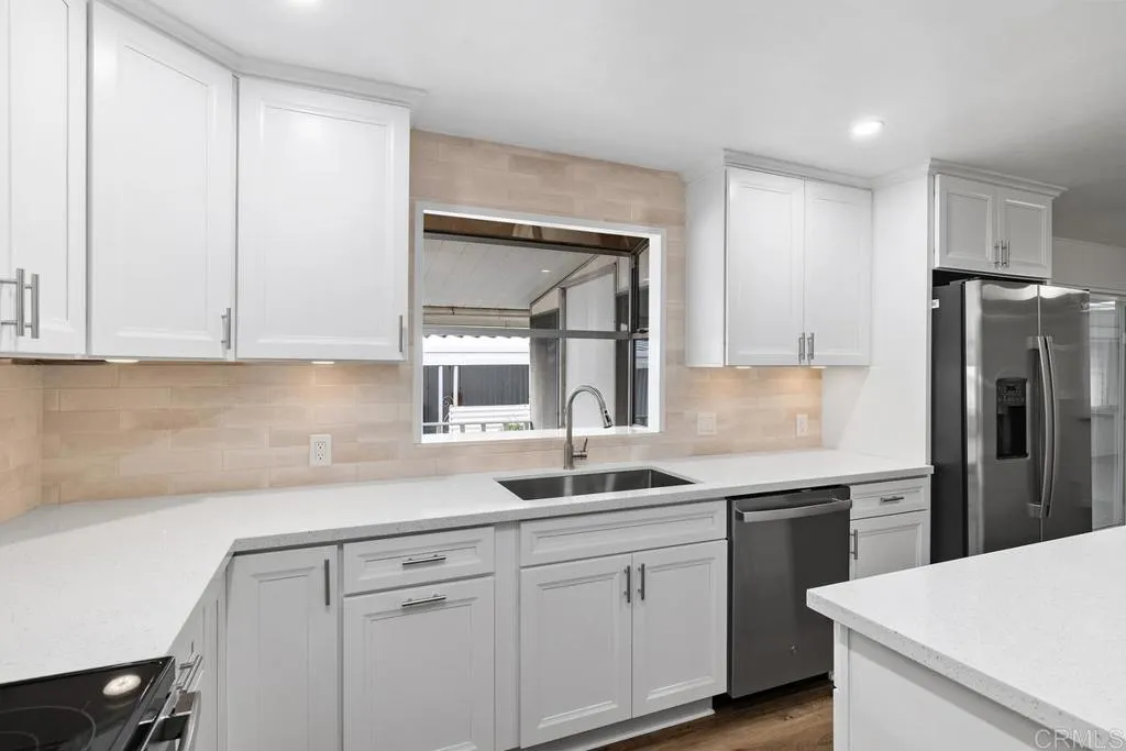 7467 Mission Gorge Road, Unit SPC 10 Santee, CA 92071 - Photo 16 of 44 a kitchen with a sink cabinets and stainless steel appliances