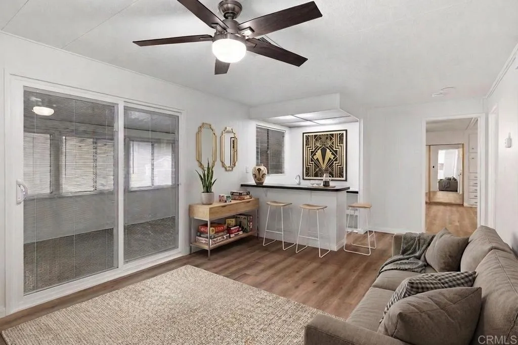 7467 Mission Gorge Road, Unit SPC 10 Santee, CA 92071 - Photo 19 of 44 a living room with furniture and a window