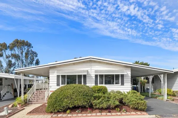 front view of a house with a garden
