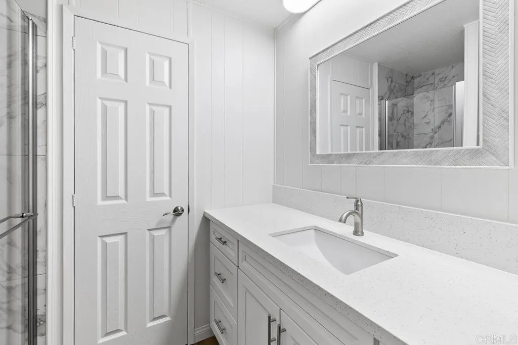 7467 Mission Gorge Road, Unit SPC 10 Santee, CA 92071 - Photo 30 of 44 a bathroom with a sink and a mirror