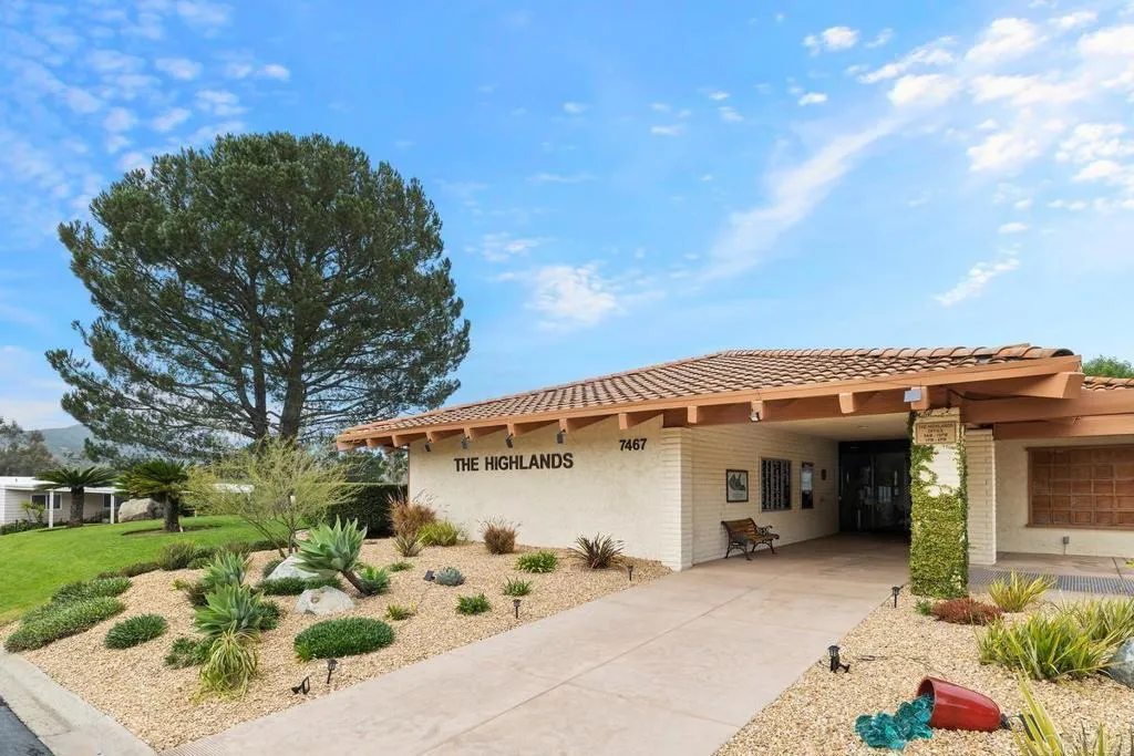 7467 Mission Gorge Road, Unit SPC 10 Santee, CA 92071 - Photo 37 of 44 a front view of a house with a garden