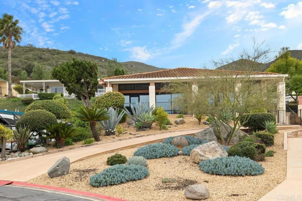 7467 Mission Gorge Road, Unit SPC 10 Santee, CA 92071 - Photo 38 of 44 a front view of a house with a yard