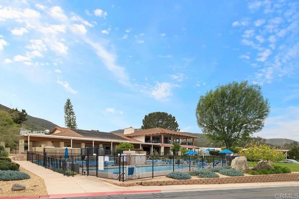 7467 Mission Gorge Road, Unit SPC 10 Santee, CA 92071 - Photo 39 of 44 a front view of a building with streets and trees