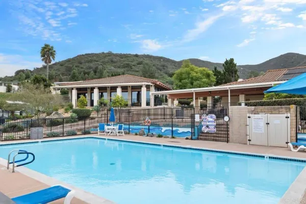 a view of a patio with swimming pool table and chairs