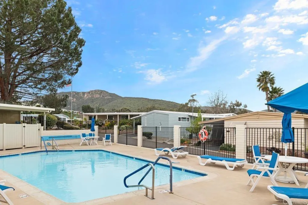 7467 Mission Gorge Road, Unit SPC 10 Santee, CA 92071 - Photo 43 of 44 a view of a patio with swimming pool table and chairs