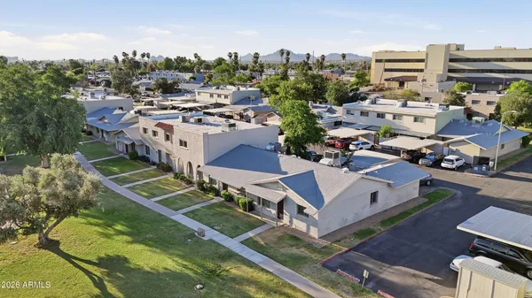 a view of a city that has lawn chairs