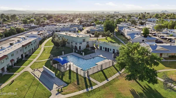 aerial view of a house with a yard