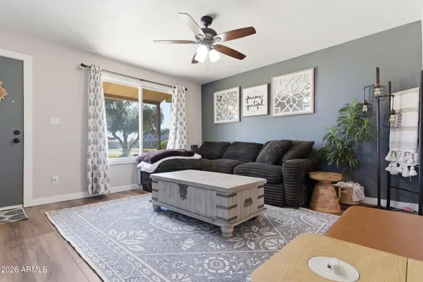 a living room with furniture and a large window