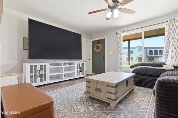 a living room with furniture and a flat screen tv
