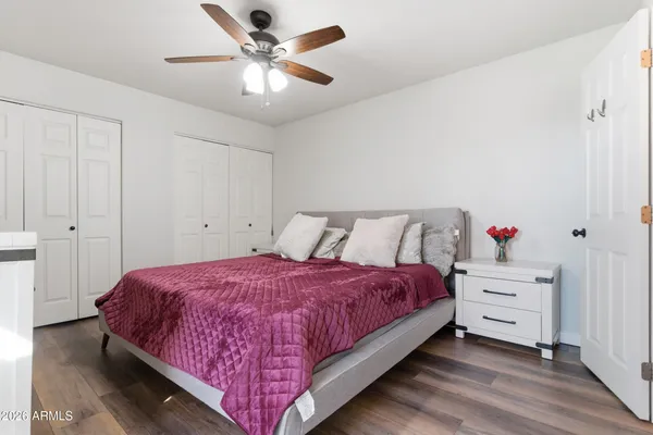 a bedroom with a bed and a chandelier