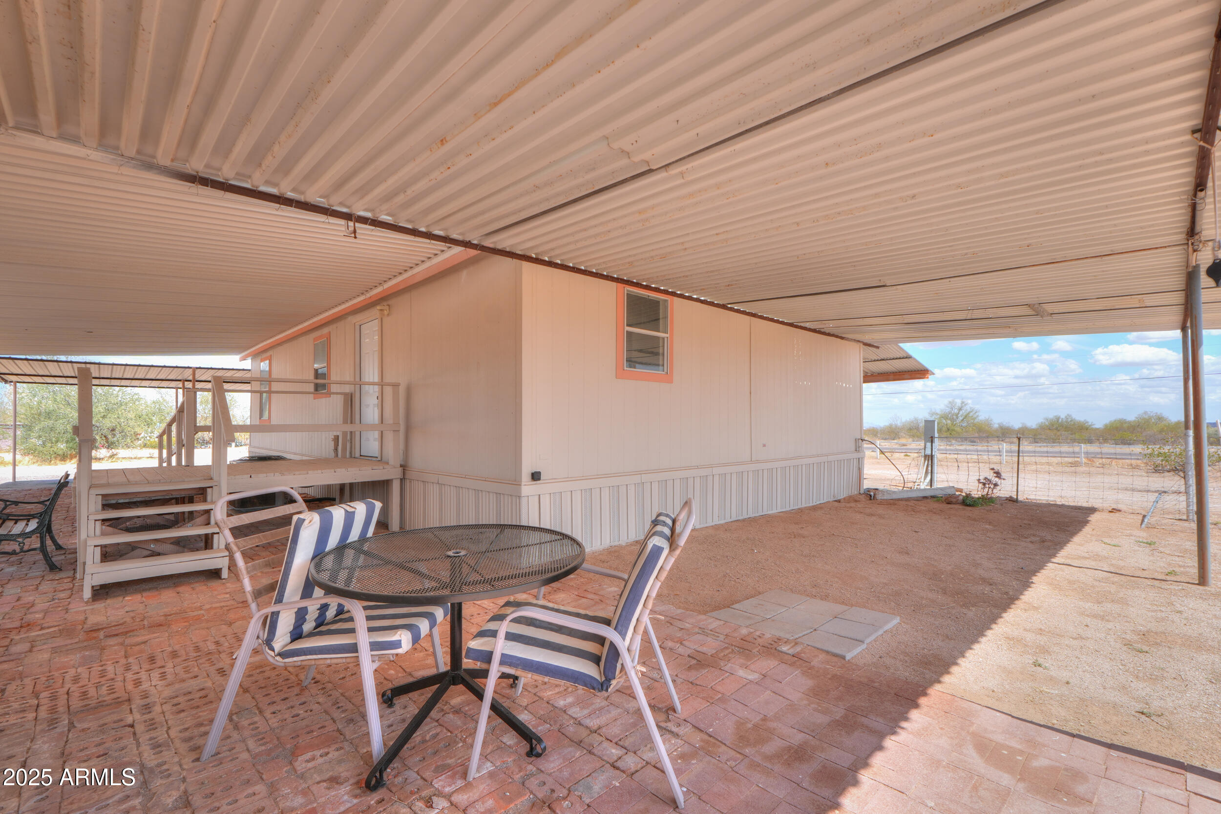 270 North Ralston Road Maricopa, AZ 85139 - Photo 45 of 75 a balcony with table and chairs