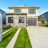 a front view of house with yard