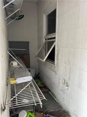 a view of garage with wooden door