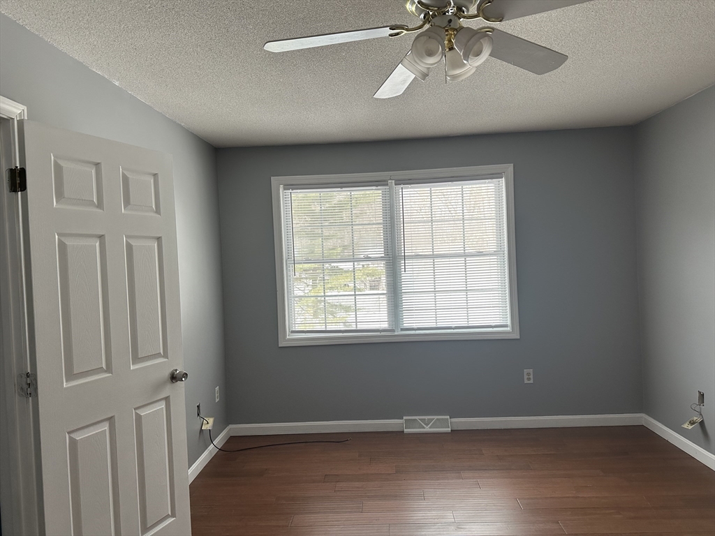 54 Old Fuller Rd Extension Chicopee, MA 01020 - Photo 15 of 25 a view of an empty room with a window and wooden floor