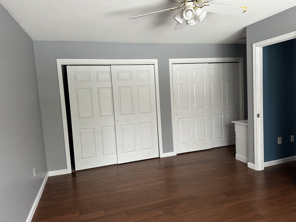 54 Old Fuller Rd Extension Chicopee, MA 01020 - Photo 16 of 25 an empty room with wooden floor and windows