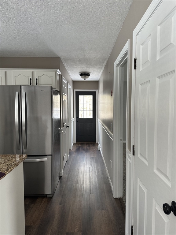 54 Old Fuller Rd Extension Chicopee, MA 01020 - Photo 25 of 25 a view of a refrigerator in kitchen and wooden floor