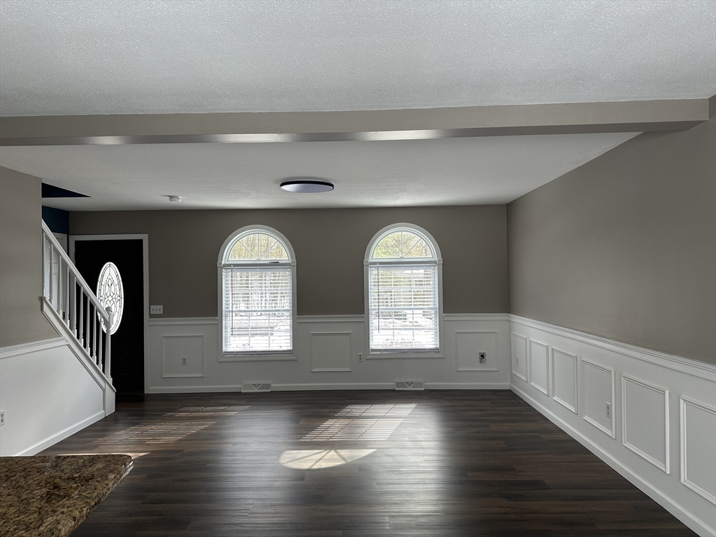 54 Old Fuller Rd Extension Chicopee, MA 01020 - Photo 5 of 25 a view of empty room with wooden floor and fan