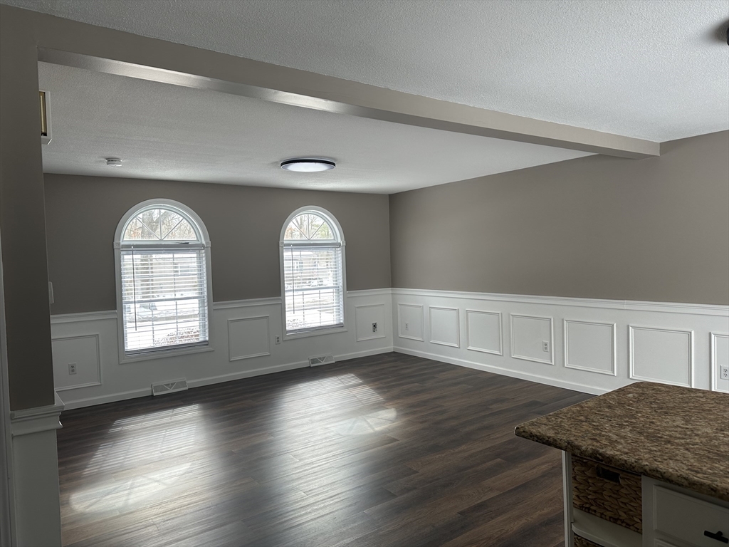 54 Old Fuller Rd Extension Chicopee, MA 01020 - Photo 6 of 25 a view of empty room with wooden floor and window