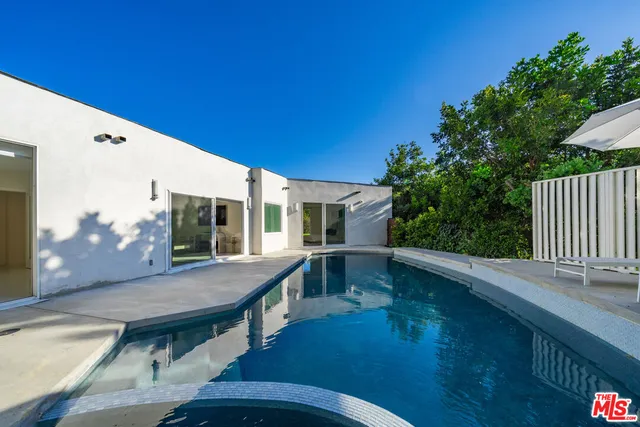 a view of balcony with two chairs and a table