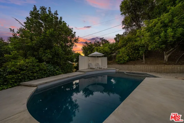 a view of swimming pool from a balcony