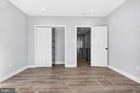 an empty room with wooden floor