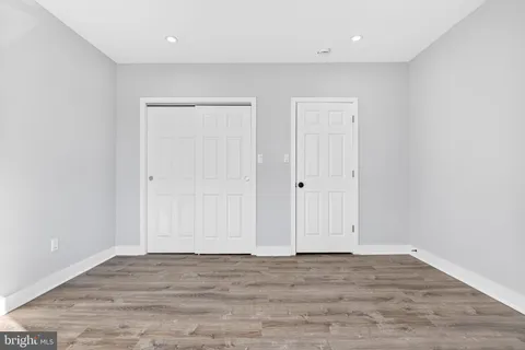 wooden floor with white walls
