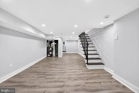 a view of hallway with wooden floor
