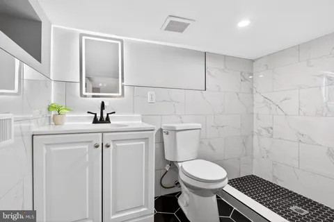 a front view of a house with a wooden fence