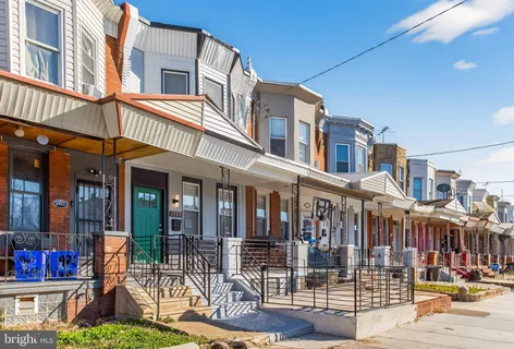 a front view of a building with street view