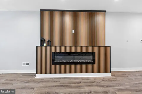 an entryway in a hall with a staircase