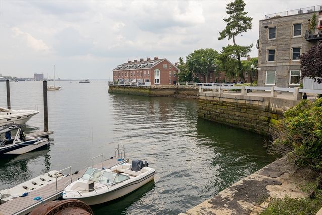 a view of a lake with tall buildings