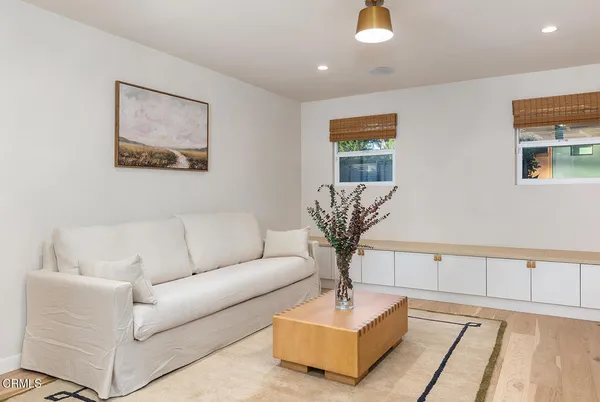 a living room with furniture and a table