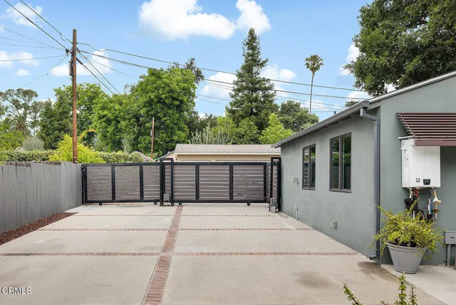 a house view with a backyard space