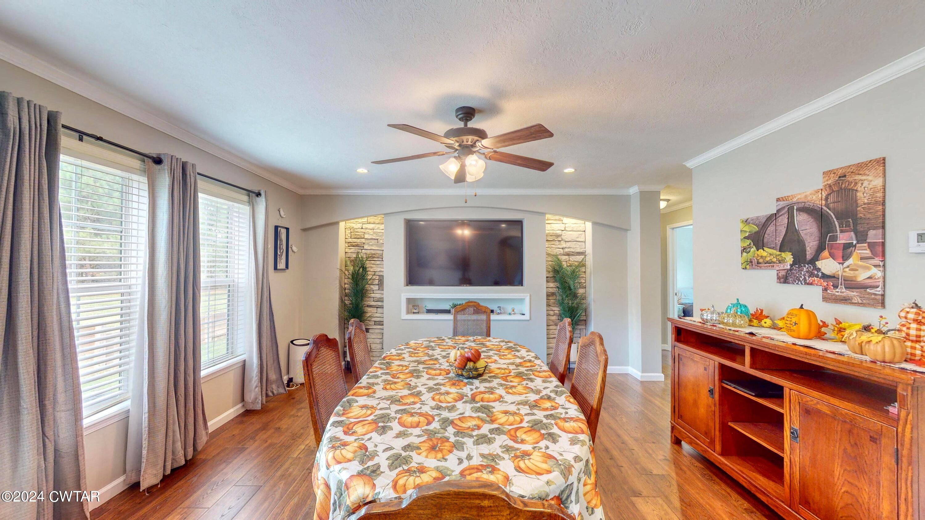 32 Jim Jackson Road Humboldt, TN 38343 - Photo 12 of 35 a living room with furniture and a flat screen tv