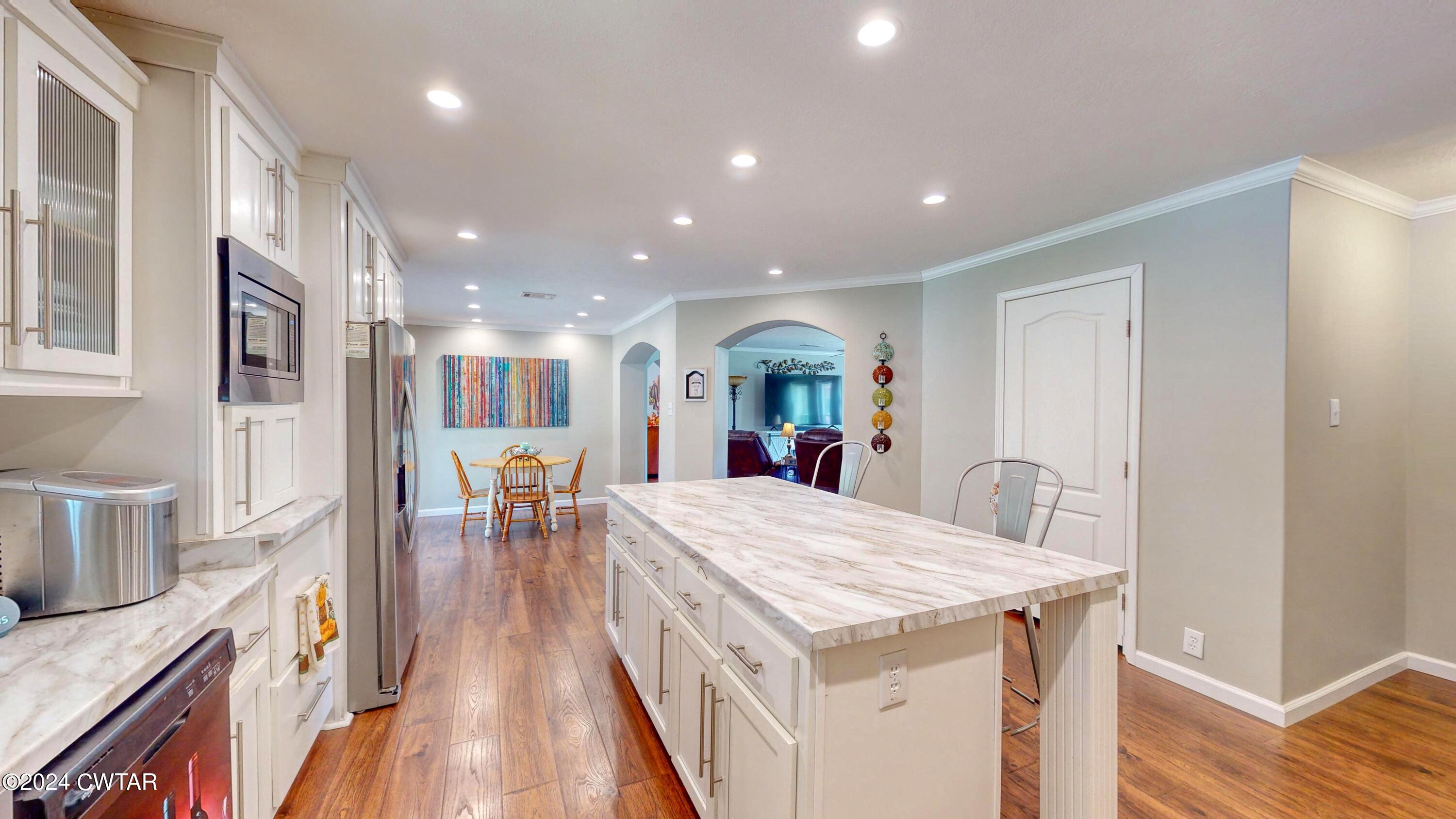 32 Jim Jackson Road Humboldt, TN 38343 - Photo 13 of 35 a large kitchen with a table and chairs