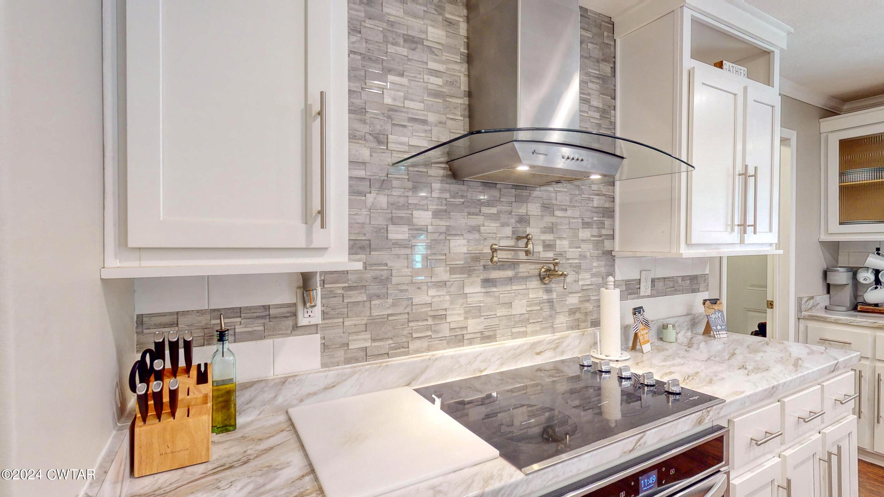 32 Jim Jackson Road Humboldt, TN 38343 - Photo 15 of 35 a kitchen with a sink and cabinets