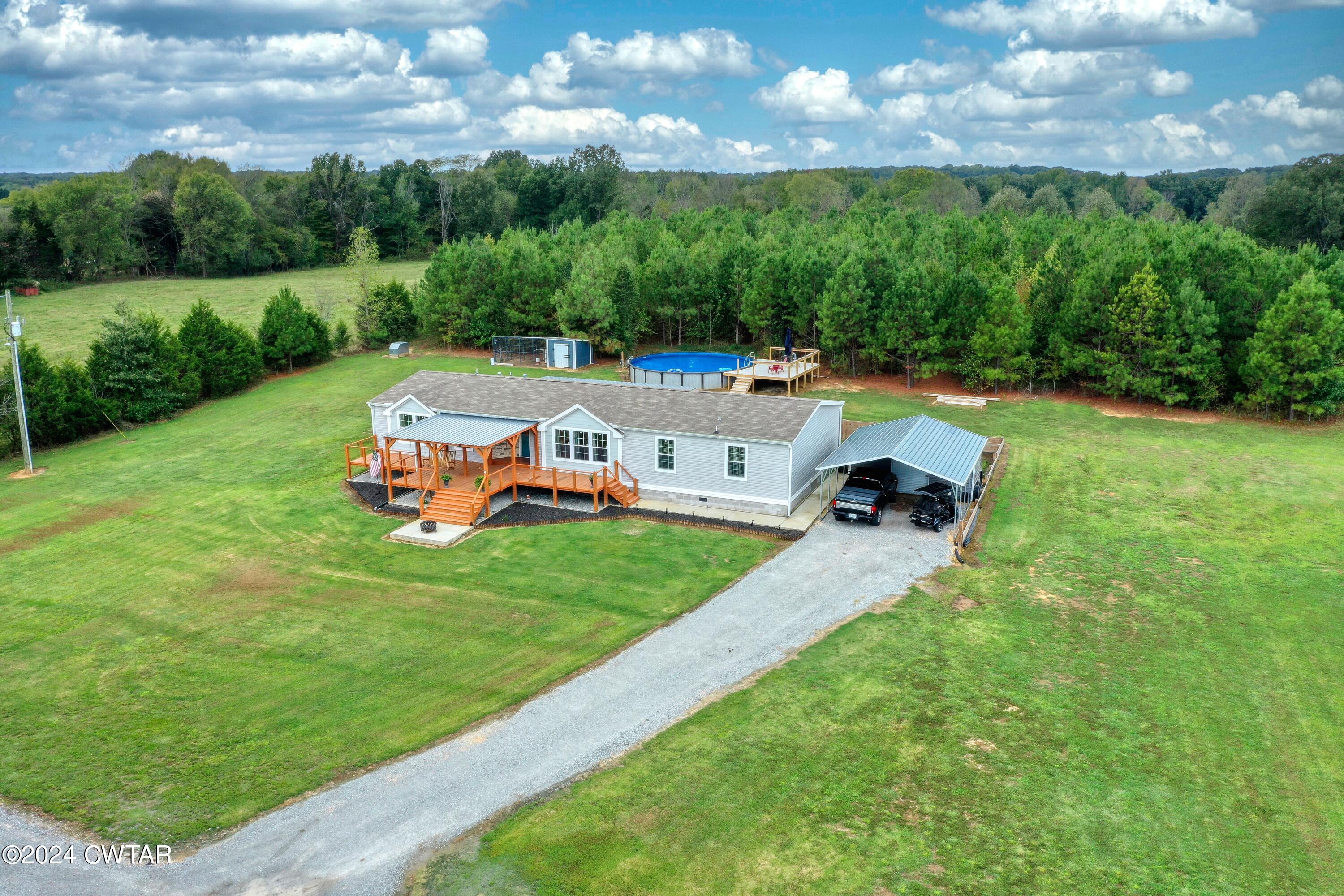 32 Jim Jackson Road Humboldt, TN 38343 - Photo 2 of 35 an aerial view of a house with backyard