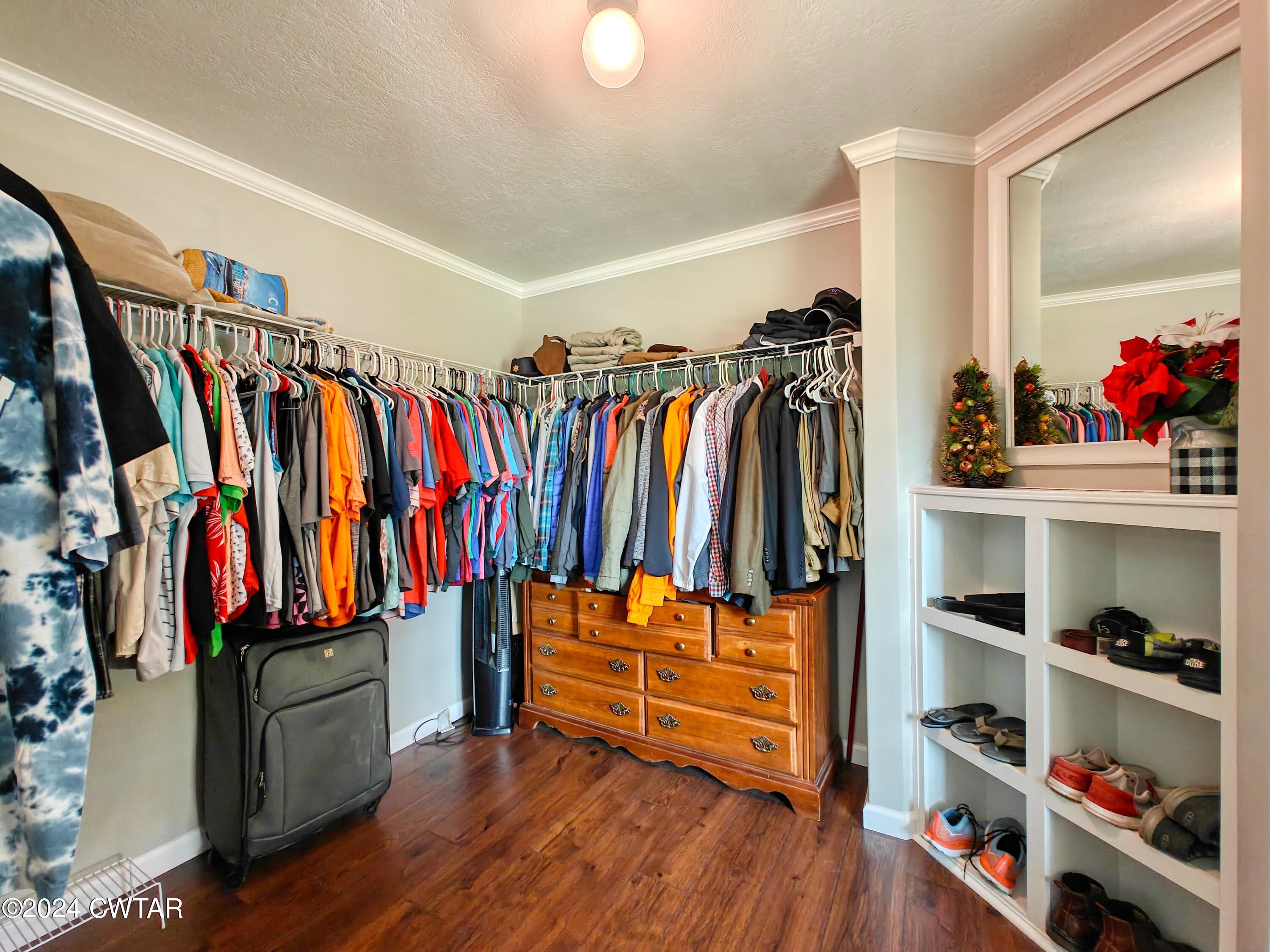 32 Jim Jackson Road Humboldt, TN 38343 - Photo 21 of 35 a view of walk in closet with clothes and shoes