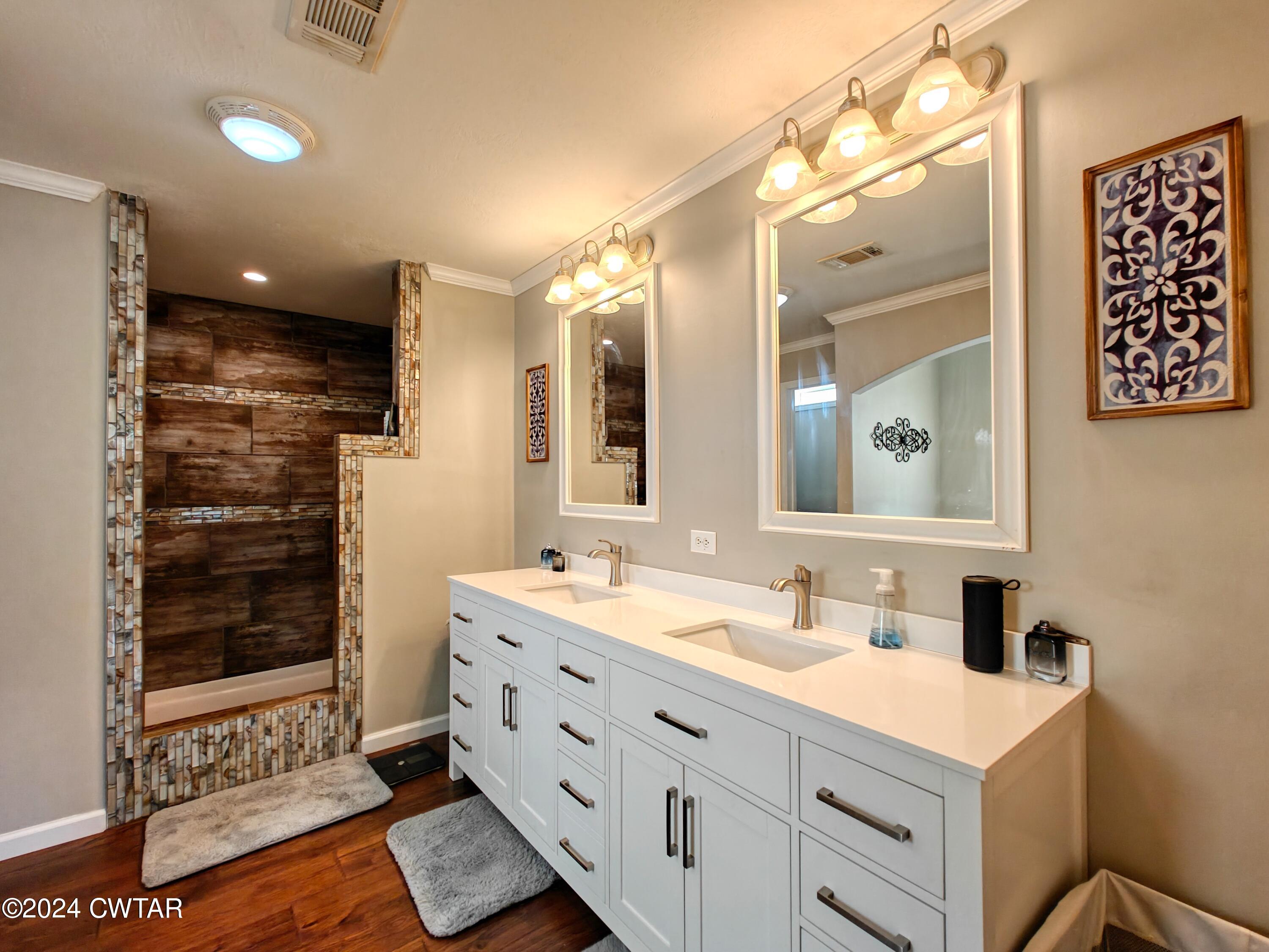 32 Jim Jackson Road Humboldt, TN 38343 - Photo 22 of 35 a bathroom with a sink mirror and shower