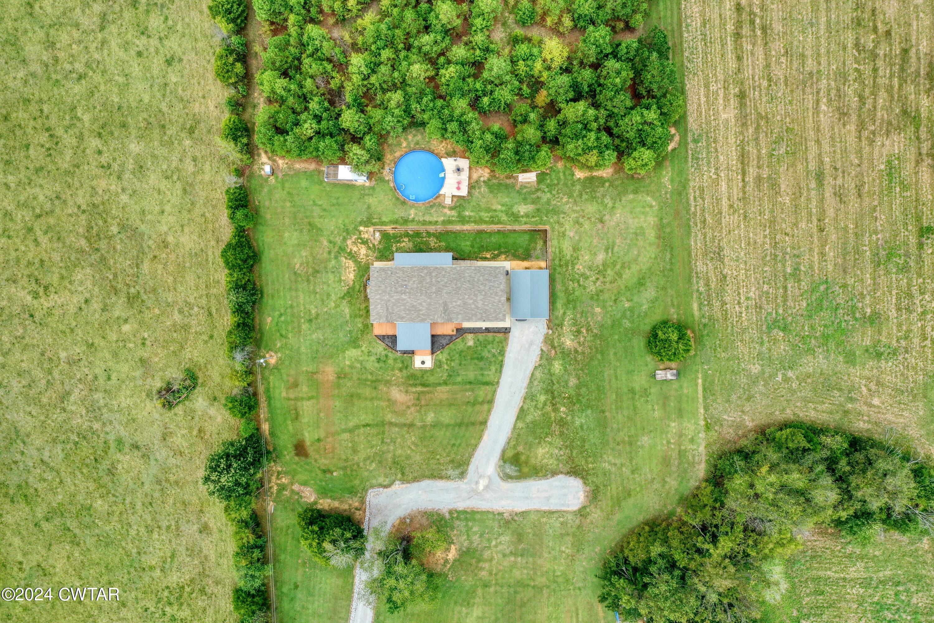 32 Jim Jackson Road Humboldt, TN 38343 - Photo 30 of 35 a view of a back yard from a garden