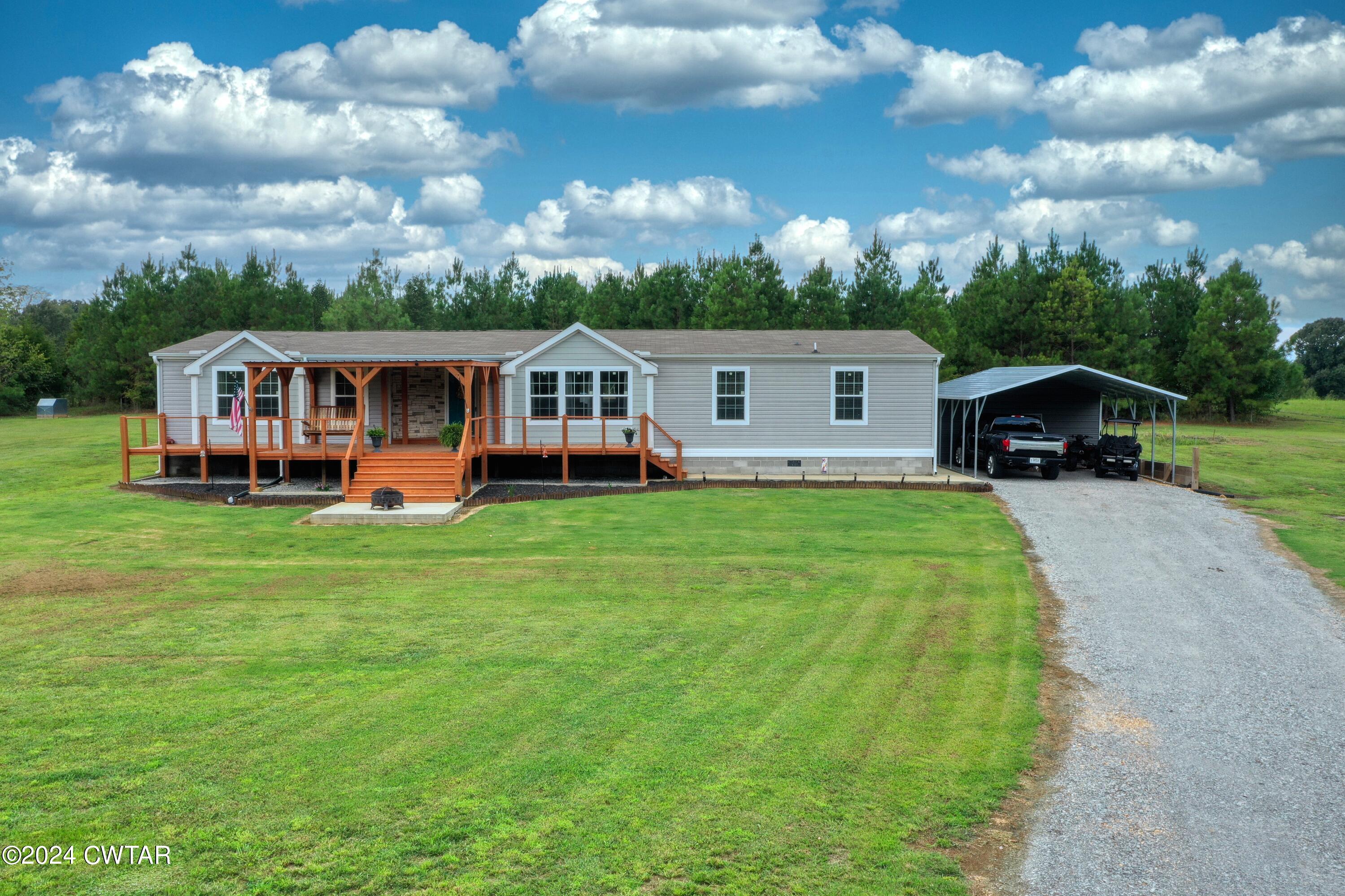 32 Jim Jackson Road Humboldt, TN 38343 - Photo 3 of 35 a front view of house with yard and green space