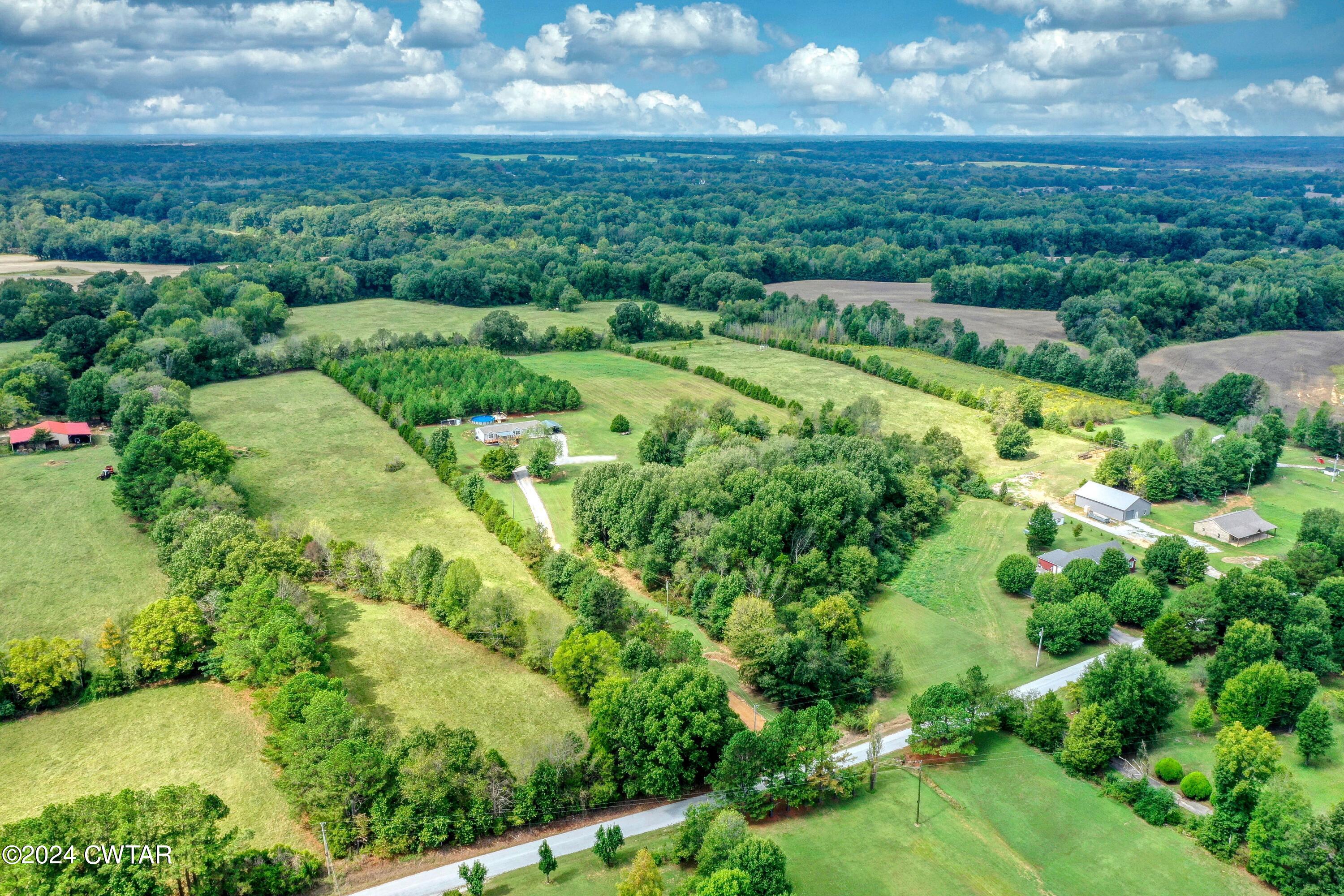 32 Jim Jackson Road Humboldt, TN 38343 - Photo 32 of 35 an aerial view of residential houses with outdoor space and trees
