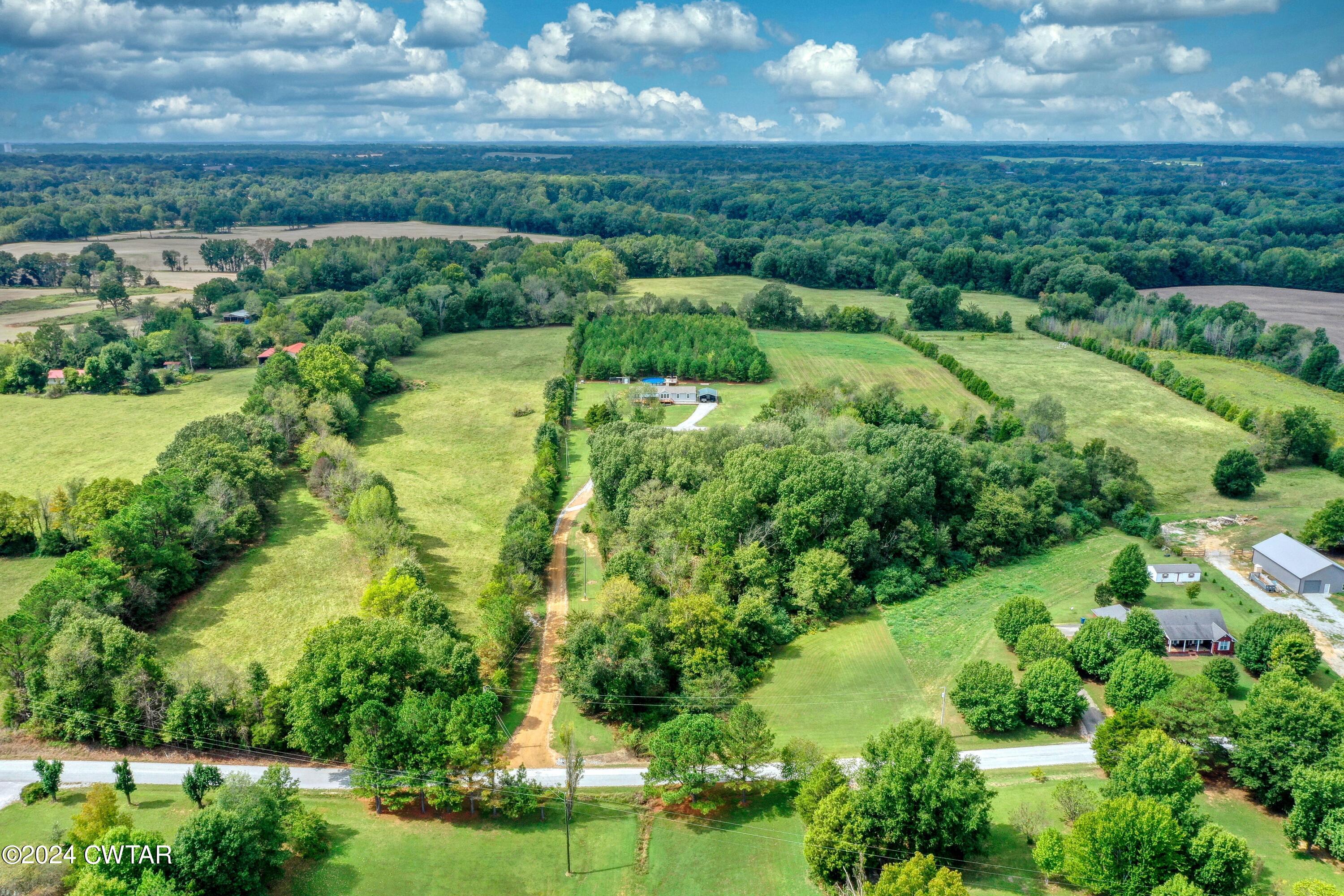 32 Jim Jackson Road Humboldt, TN 38343 - Photo 33 of 35 an aerial view of residential houses with outdoor space and trees
