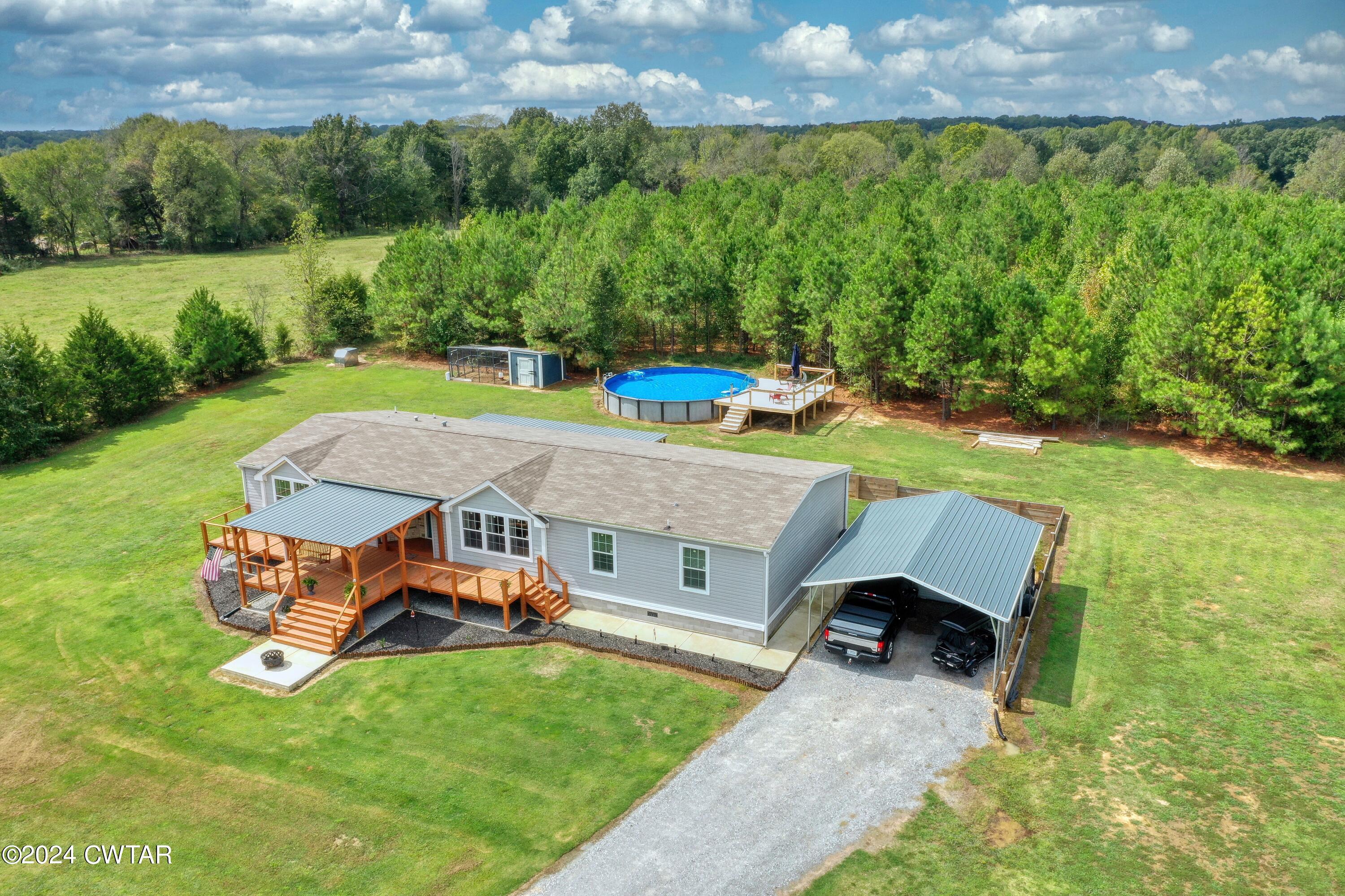 32 Jim Jackson Road Humboldt, TN 38343 - Photo 4 of 35 an aerial view of a house with backyard