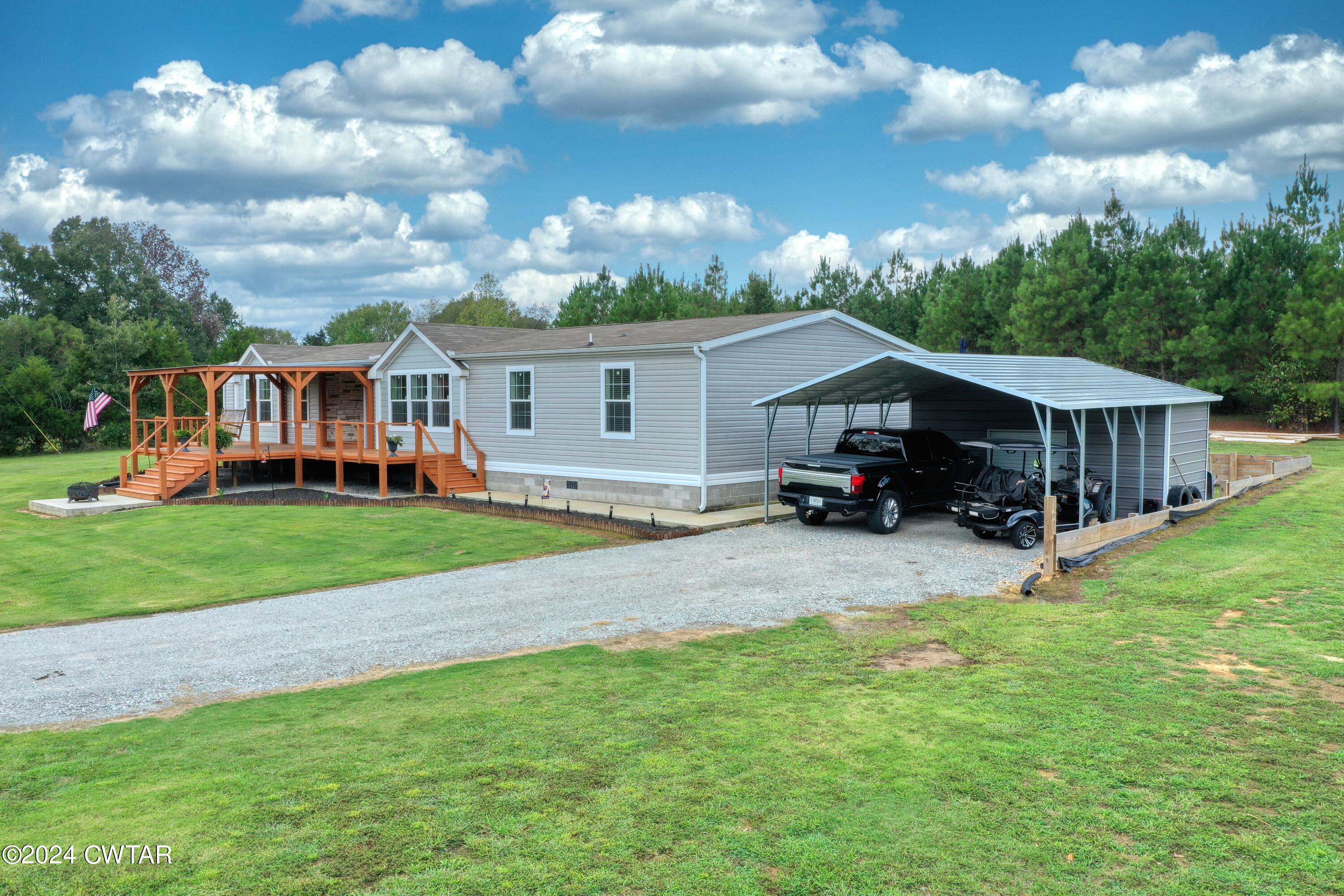 32 Jim Jackson Road Humboldt, TN 38343 - Photo 5 of 35 a front view of house with yard and green space