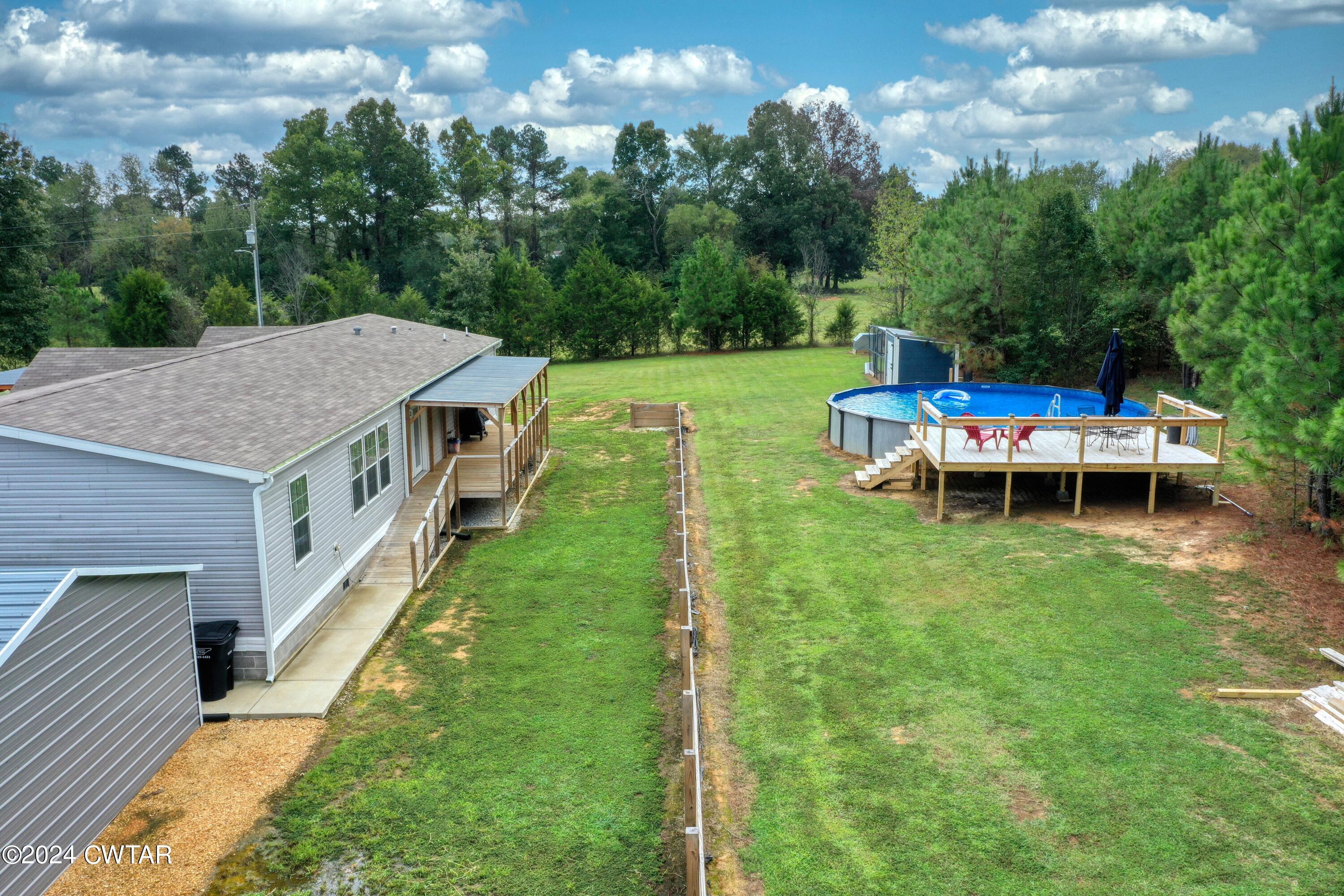 32 Jim Jackson Road Humboldt, TN 38343 - Photo 6 of 35 a view of a house with backyard