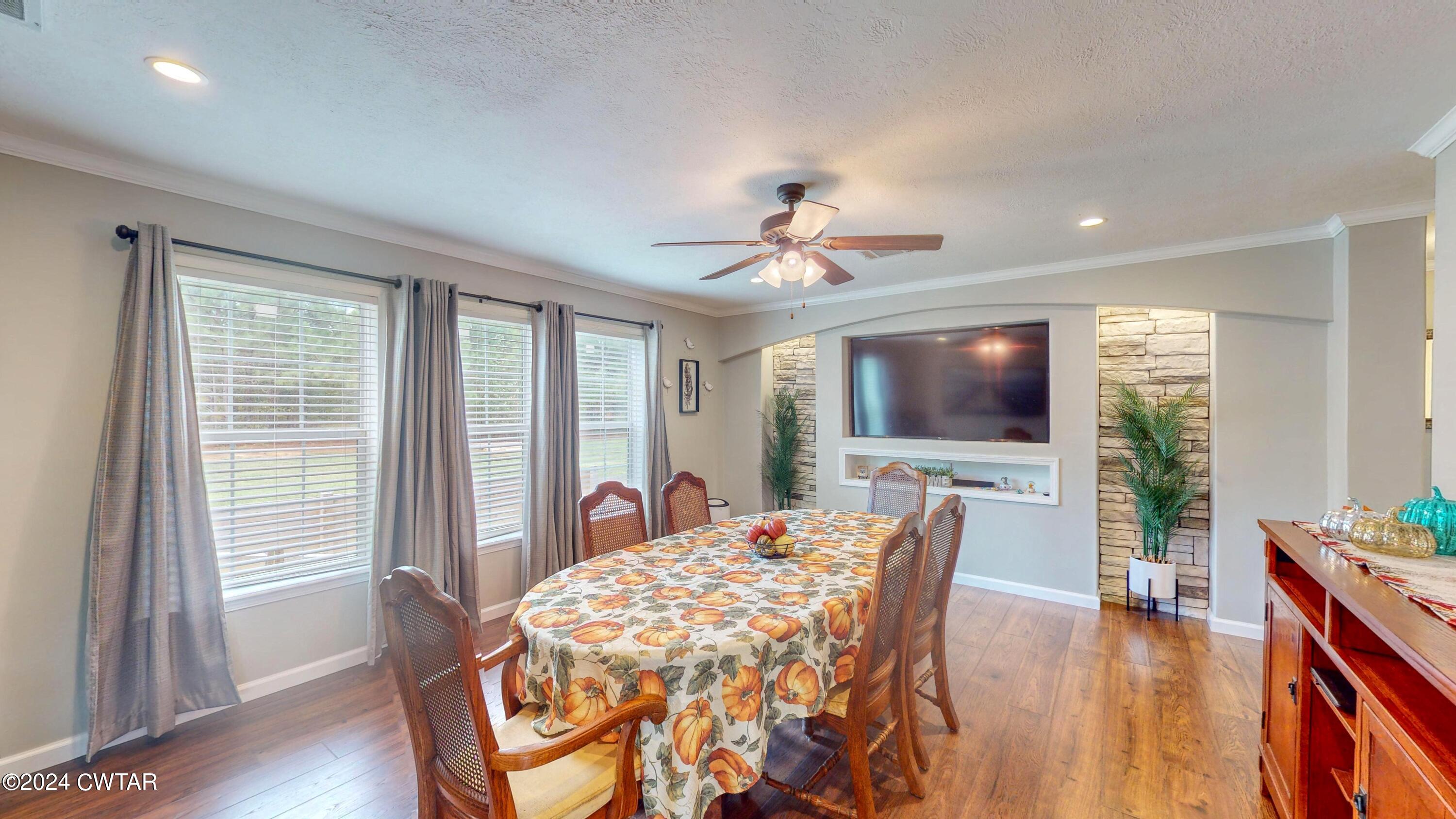 32 Jim Jackson Road Humboldt, TN 38343 - Photo 9 of 35 a living room with furniture and a flat screen tv